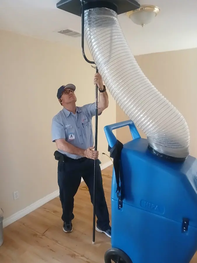 Furnace Tune-Up technician using HEPA equipment in Lake Forest
